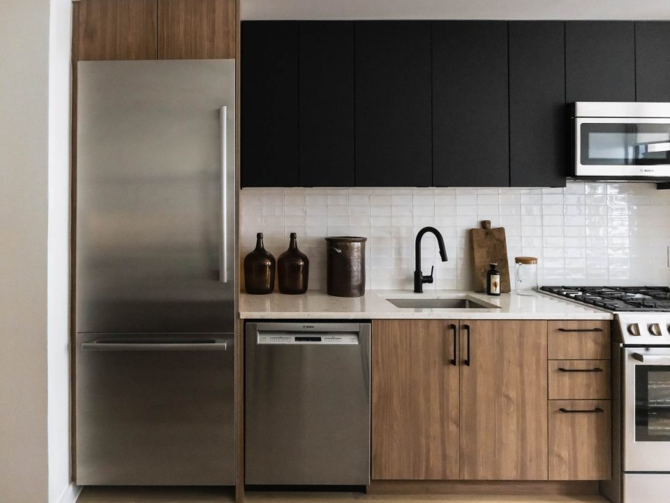 Old Fourth Ward Apartments - Overline - Kitchen with Tile Backsplash, Stone and Quartz Countertops, and Bosch Stainless Steel Appliances, and Modern Decor